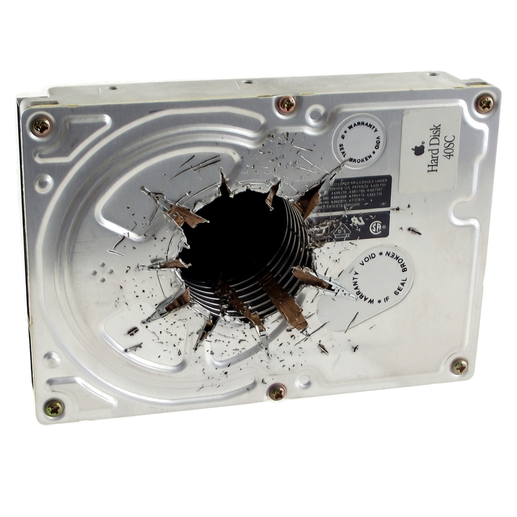 A 3.5-inch hard disk drive after physical destruction — drilled through the platter, evidence of irrecoverable data destruction